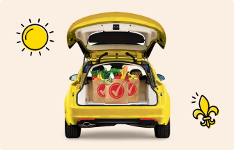 Yellow car with an open trunk showing Winn-Dixie paper bags filled with groceries.
