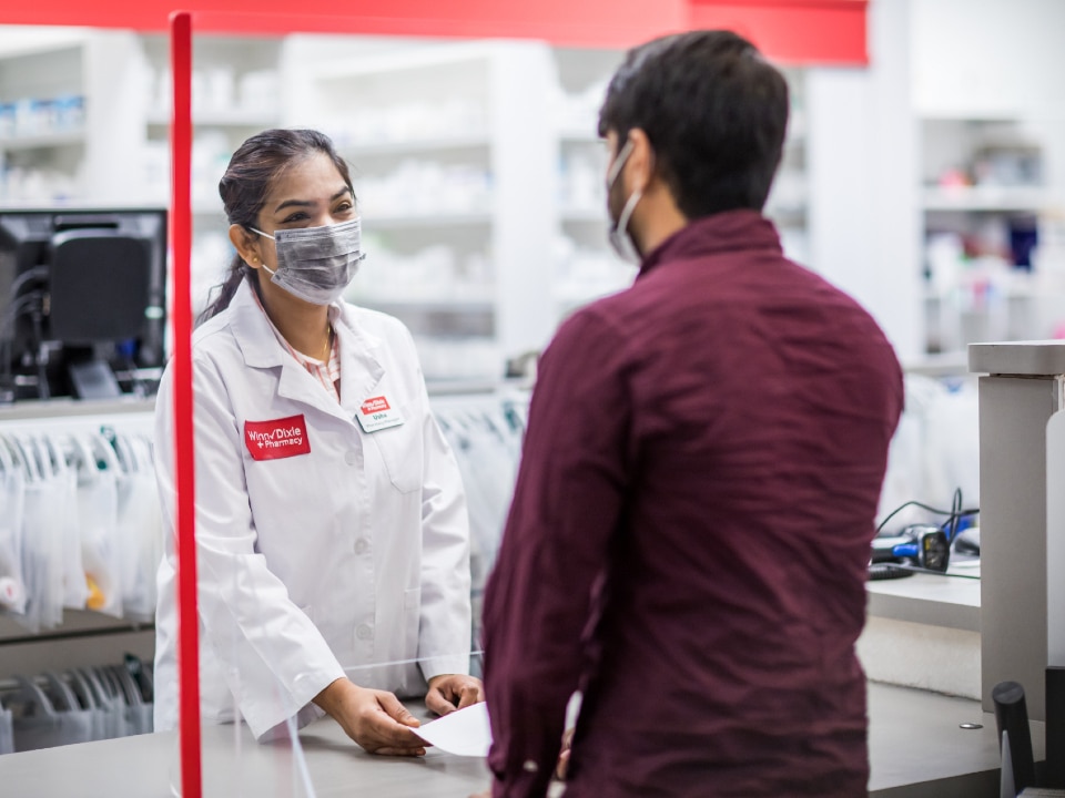 Winn-dixie Pharmacy - Pharmacist discussing COVID-19 Vaccine with customer