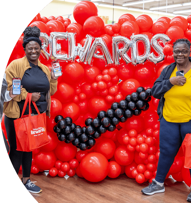Winn-Dixie employees smiling with bags of groceries
