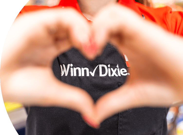 Winn-Dixie employee making a heart gesture with their hands