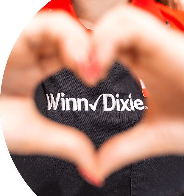 Winn-Dixie employee making a heart gesture with their hands