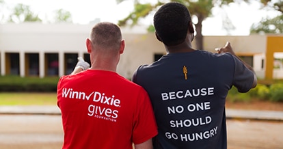 Volunteers standing side by side