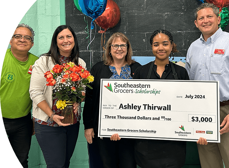 SEG intern and scholarship winner showcasing $3,000 reward.