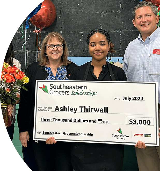 SEG intern and scholarship winner showcasing $3,000 reward.