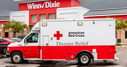 American Red Cross ambulance in front of a Winn-Dixie store