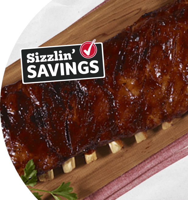 Rack of ribs on a grey background. Text that reads Sizzlin' Savings with a Winn-Dixie check mark