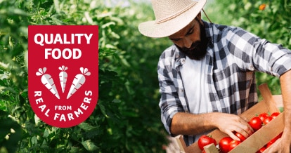 Male farmer holding a box of tomatoes with text that reads "quality food from real farmers"