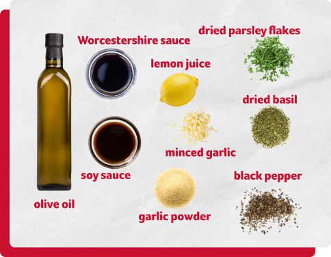 Steak marinade ingredients - Worcestershire sauce, soy sauce, lemon juice, minced garlic, garlic powder, dried parsley flakes, dried basil, black pepper.