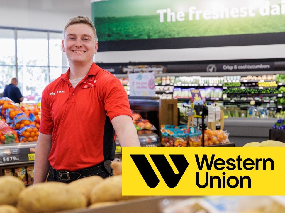 Smiling Winn-Dixie associate standing by the produce section. In front of the image, there is the Western Union logo.