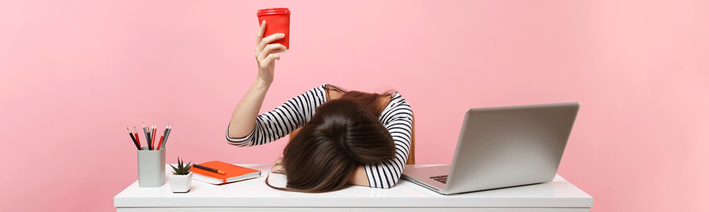 tired woman on the desk at work
