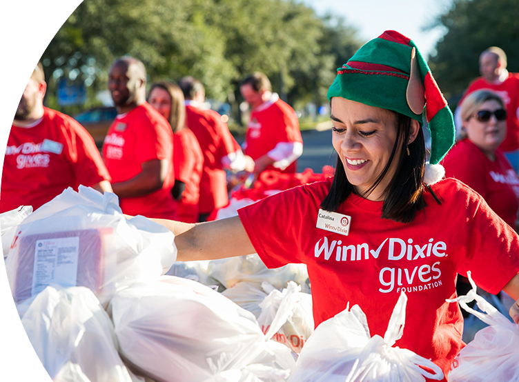 Woman sorting food donations at Winn-Dixie gives foundation event