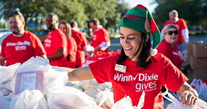 Woman sorting food donations at Winn-Dixie gives foundation event