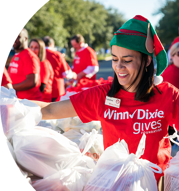 Woman sorting food donations at Winn-Dixie gives foundation event