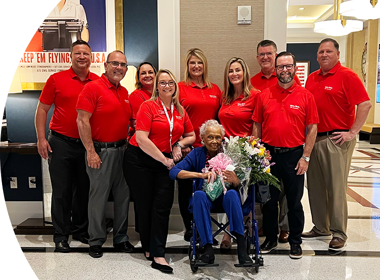 A group of Winn-Dixie employee with Romay Davis.