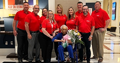 A group of Winn-Dixie employee with Romay Davis.