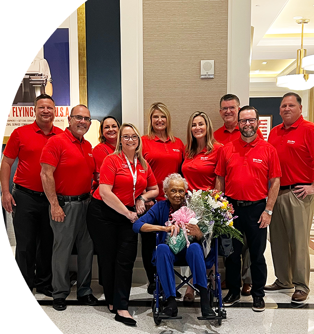 A group of Winn-Dixie employee with Romay Davis.