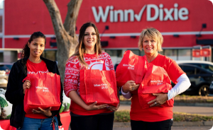 Winn-Dixie gives foundation volunteer gathering donations.